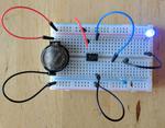 Blinking Blue- Powering a 3.7 volt LED from a 2.4 volt coin cell with a $0.02 charge pump