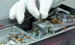 Researchers developing a new balance for the new kilogram