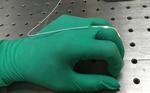 In a first for wearable optics, researchers develop stretchy fiber to capture body motion