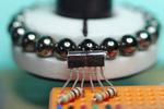 Low-cost and precise rotary encoder with magnetic spheres
