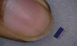 Flea-sized solar panels embedded in CLOTHES can charge a mobile phone