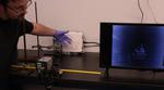 Using Computational Chemistry to Produce Cheaper Infrared Plastic Lenses