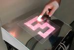 Novel tactile display using computer-controlled surface adhesion