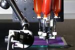 Multimaterial 3D printing with a twist