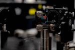 Fast light pulse triggers charge transfer into water